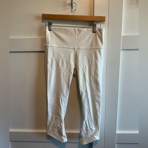 Gently used white lululemon leggings with mesh panels.